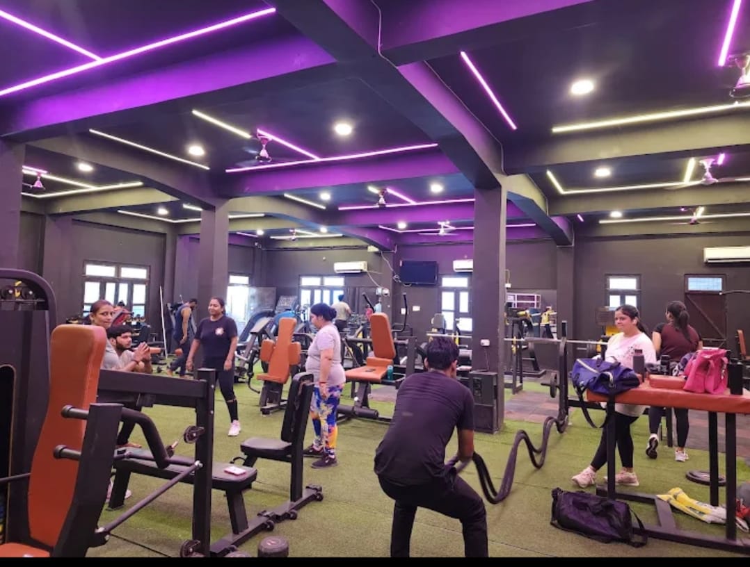 Iron Universe Gym — main floor with members training